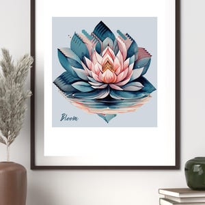 May include: A framed watercolor print featuring a lotus flower in shades of pink, teal, and blue. The artwork includes the word "Bloom" in a script font. The image is set against a light blue background, with a reflection of the flower.