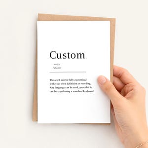 May include: A white greeting card with black text featuring the word Custom, the noun label, a phonetic pronunciation, and a description stating the card can be fully customised with your own definition or wording in any standard language.