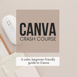 May include: A beige background with a white computer mouse, a notebook, and a pen. The text "CANVA CRASH COURSE" is displayed in large, black letters. Below, the text reads "A calm, beginner-friendly guide to Canva."