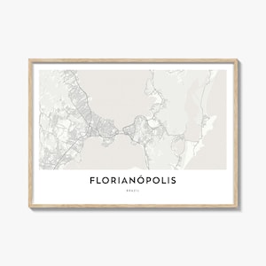 May include: A framed map print of Florianópolis, Brazil, in grayscale. The map details the city's layout, including roads and waterways. The city name is displayed in a bold, black font at the bottom, with "BRAZIL" below it.