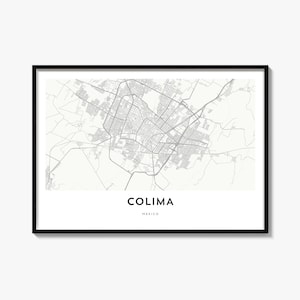 May include: A framed wall art print featuring a detailed grey and white street map of Colima, Mexico. The map displays a complex network of roads and city blocks. Below the map, the text reads COLIMA in large letters and MEXICO below it.
