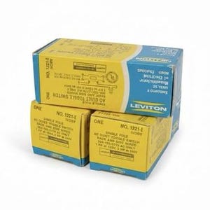 May include: Three stacked boxes of electrical switches. The boxes are yellow with blue accents and feature product information and the brand name "Leviton". The boxes are labeled "NO. 1221-I IVORY AC QUIET TOGGLE SWITCH".