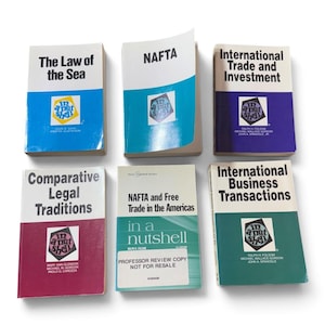 May include: Six softcover law books from the In a Nutshell series, featuring titles such as The Law of the Sea, NAFTA, International Trade and Investment, Comparative Legal Traditions, NAFTA and Free Trade in the Americas, and International Business Transactions.