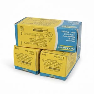 May include: Three stacked yellow and blue Leviton boxes. Each box is labeled with the product name, "AC Quiet Toggle Switch," and the model number "1221-I Ivory." The boxes have text and diagrams printed on them.