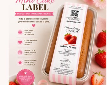 May include: A mini cake in a clear container with a label that reads "Strawberry Crunch." The label includes the bakery name, ingredients, and net weight of 9 oz. Fresh strawberries are scattered around the cake. The label is 2" x 8".