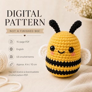 May include: A digital crochet pattern for a bee, featuring a 15-page PDF in English with US crochet terms. The pattern creates a bee approximately 4 inches tall. The text reads: DIGITAL PATTERN, NOT A FINISHED BEE, 15-page PDF, English, US crochet terms, Approx. 4 in / 10 cm.