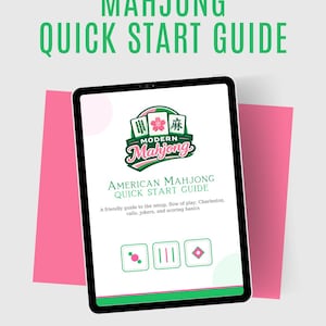May include: A tablet displaying a "Mahjong Quick Start Guide." The screen shows the title "American Mahjong Quick Start Guide" with a logo and icons. The background is light gray with pink accents and the text "Modern Mahjong."