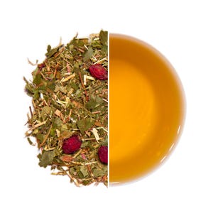 May include: A split image showing loose leaf tea and brewed tea. The tea leaves are a mix of green and brown with red berries. The brewed tea is a golden amber colour. The image is split vertically.