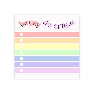 May include: A notepad with a rainbow-colored striped design. The text "be gay do crime" is written in pink and purple cursive at the top. Each stripe has a white dot on the left side.