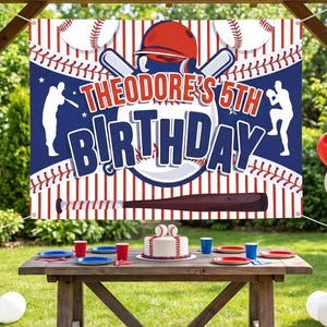 May include: A rectangular banner featuring a baseball theme with red pinstripes, a large baseball graphic, a red helmet, and a brown bat. The text reads "THEODORE'S 5TH BIRTHDAY" in bold blue and red letters, flanked by silhouettes of baseball players.