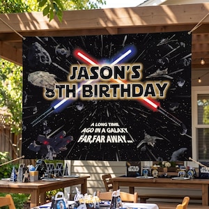 May include: A black banner with the text "JASON'S 8TH BIRTHDAY" and "A LONG TIME AGO IN A GALAXY FAR, FAR AWAY..." features a Star Wars theme. The banner includes lightsabers, spaceships, and a starry background.