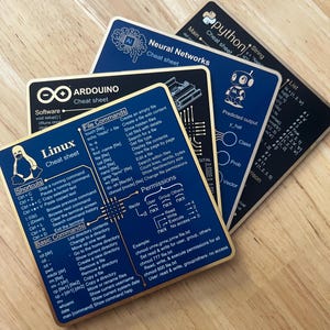 May include: A set of four rectangular coasters featuring technical cheat sheets for Linux, Arduino, Neural Networks, and Python. Each coaster has a dark blue or black background with white text, diagrams, and programming code snippets.