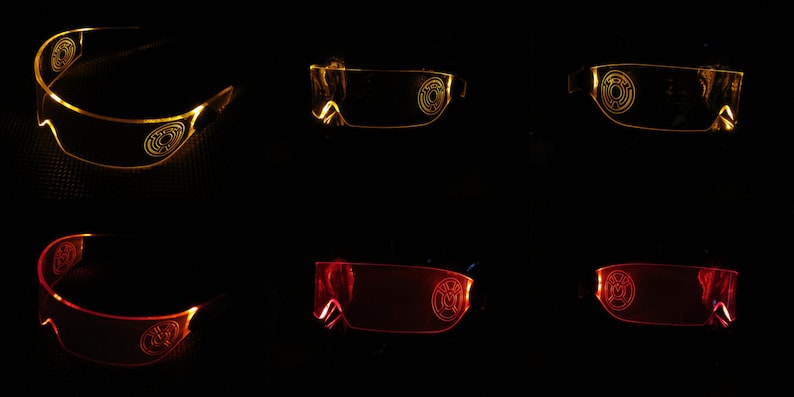May include: Two pairs of LED light-up glasses, one pair is yellow and the other is red. The glasses have a circular design on the lenses.