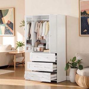 May include: A white wardrobe featuring two doors, one with a mirror panel, and three lower drawers. The interior includes a hanging rod with various garments and a shelf holding folded items and a small handbag. The unit has a clean, rectangular frame.