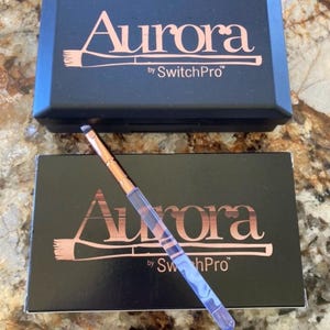 The "Aurora by SwitchPro" is a makeup brush set and sanitizing system.