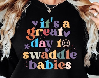 It's A Great Day To Swaddle Babies Sweatshirt, Funny Nurse Sweatshirt, Labor Delivery NICU OB Nurse Gift, Cute Medical Work Top