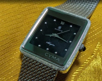 Reloj Cyma estilo tanque, cuarzo suizo, vintage, rectangular, minimalista, con correa de malla, unisex. Batería nueva.