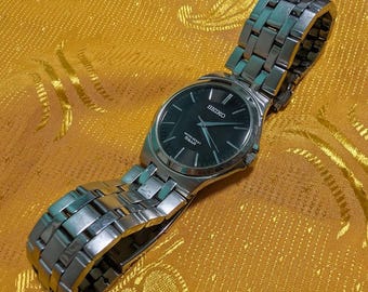Vintage Seiko 7N01-0DM0 Minimalist Black Dial Watch 35mm Slim Stainless Steel Quartz Working Japan