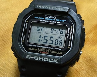 Reloj digital Casio G-Shock DW-5600E Fox Fire vintage, resistente a golpes hasta 200 m, retroiluminación EL, batería nueva, video en funcionamiento, estilo japonés.