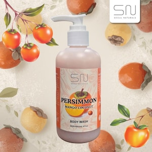May include: A clear plastic bottle of Seoul Naturals body wash with a white pump dispenser. The label features the text Persimmon Mango Coconut, 100% Natural, 8 fl oz, and a graphic of a sliced persimmon against a marbled background.