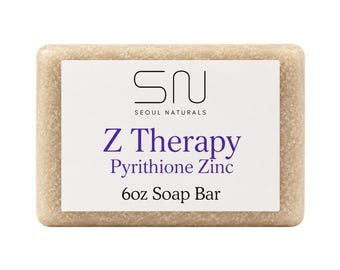 Jabón en barra Z Therapy con piritionato de zinc, avena coloidal, aceite de tamanu, inspirado en la cosmética coreana.
