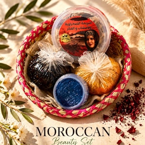 May include: A Moroccan beauty set in a woven basket. The set includes a clear container with Arabic text, small jars, and wrapped items. The text "MOROCCAN Beauty Set" is displayed below the basket, with "NATURAL & HANDMADE" underneath.