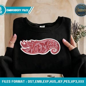 May include: Black sweatshirt with a red and white "Hot Mess" design. The design is in a flame-like shape. The image also includes text that says "5 SIZE EMBROIDERY FILES" and "Urban Stitch".