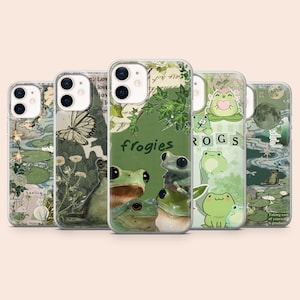 May include: Five phone cases with frog and botanical designs in shades of green and white. One case features the word "frogies". The cases have different illustrations of frogs, butterflies, and plants. Each case has a unique design.
