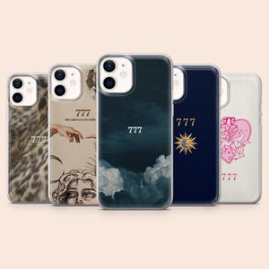 May include: A collection of five phone cases with various designs. The cases feature images of a leopard print, a Renaissance-style hand, a cloudy sky, a sun and moon, and a pink heart. Each case has the number "777" printed on it.