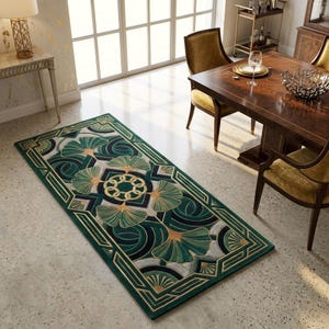 May include: A rectangular green rug with a geometric design featuring stylized ginkgo leaves in shades of green, gold, and white. The rug has a dark green border with gold accents, suitable for a living room or dining area.