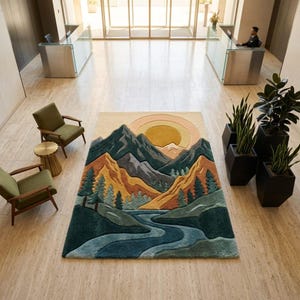 May include: A rectangular area rug with a mountain landscape design. The rug features a river, trees, and mountains in shades of blue, green, orange, and gray, with a sun in the background. The rug is placed on a light-colored tiled floor.