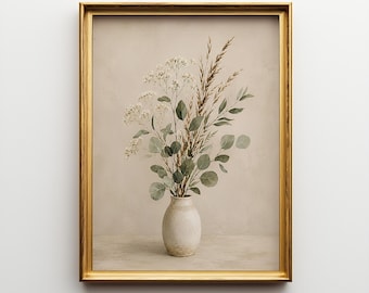 May include: A framed wall art print featuring a beige ceramic vase filled with a bouquet of dried eucalyptus leaves, tall brown grasses, and small white flowers. The artwork is enclosed in a thin, metallic gold rectangular frame.