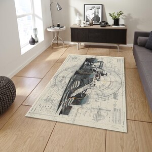 May include: Rectangular area rug featuring a detailed blueprint design of a vintage race car. The rug has a cream-colored background with black and gray mechanical illustrations. The race car is depicted in shades of gray and black.