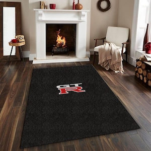 May include: A set of three ceramic mugs with a speckled, matte finish. The mugs are in shades of cream, light brown, and dark brown. Each mug has a simple, minimalist design and a rounded handle.