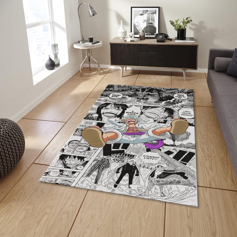 May include: Rectangular area rug featuring a black and white manga comic strip design. The rug showcases panels with characters and speech bubbles, with a central image of a character in a relaxed pose. The rug is placed on a wooden floor.