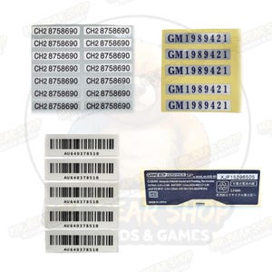 May include: A collection of adhesive labels and stickers. The labels feature text such as "CH2 8758690" and "GM1989421". Barcode stickers with "AU640378510" are also present, along with a Game Boy Advance SP label.