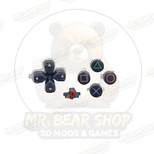 May include: A set of black PlayStation controller buttons, including a directional pad, a set of four action buttons with colored symbols, and a small, multi-colored button. The text "MR. BEAR SHOP 3D MODS & GAMES" is visible.