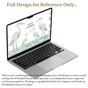 A laptop with a full-screen design displays four herons of varying heights facing each other. In the center, the word “mah jongg” is spelled out. Bamboo stalks flank the design, and the base resembles sea glass mosaic tiles.