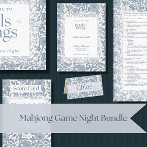 May include: A Mahjong Game Night Bundle with invitations, score cards, and place cards. The stationery features a blue floral design. The invitation reads "Petals + Pungs" and "a ladies game night".