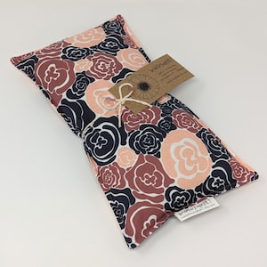 May include: A floral print heat pack with a brown tag that reads "Made for You by KT" and "Cold or Hot Pack".