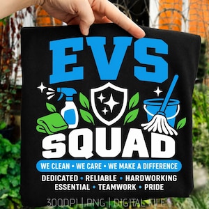 May include: A black t-shirt featuring a graphic with the text EVS SQUAD in blue and white. The design includes a spray bottle, a green cloth, a shield with stars, and a mop in a bucket. Below, the text reads WE CLEAN WE CARE WE MAKE A DIFFERENCE.
