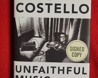 Libro firmado de Elvis Costello: Música infiel y Tinta que desaparece
