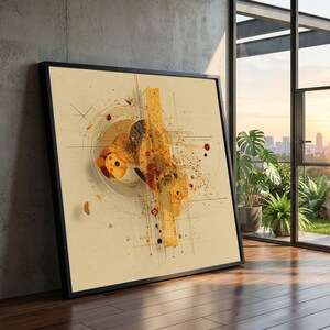 Op de afbeelding: Abstracte kunstafdruk in een zwarte lijst. Het kunstwerk heeft een beige achtergrond met geometrische vormen, lijnen en spetters in tinten geel, oranje en rood. De ingelijste kunst leunt tegen een betonnen muur, met uitzicht op een stadsgezicht.
