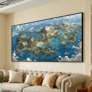 May include: Large framed artwork depicting a detailed fantasy map of a landmass with mountains, forests, and bodies of water. The artwork is framed in black and hangs above a beige sofa with decorative pillows.