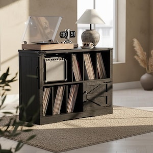 May include: A dark wood record player stand with a turntable, amplifier, and a collection of vinyl records. A lamp and a flip clock sit on top. The stand has a rustic, farmhouse style and is placed on a beige rug.