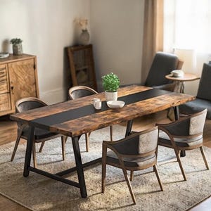 May include: A rustic dining table with a dark center inlay and black metal legs. The table is surrounded by six chairs with wooden frames and gray upholstered seats. A small plant and decorative items sit on the table.