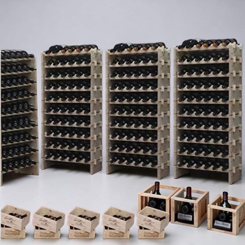 May include: Wooden wine racks filled with dark bottles. Several racks are arranged together, with smaller wooden crates holding additional bottles in front. The racks are made of light-colored wood, and the bottles are dark.