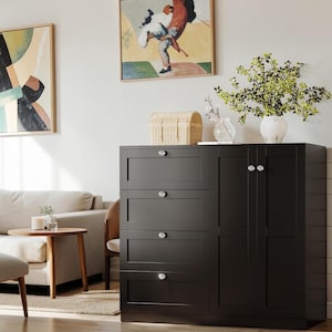 May include: A black wooden storage cabinet featuring four horizontal drawers on the left side and a double-door cupboard on the right side. Each drawer and door is equipped with a small, round, clear glass knob for opening and closing the unit.