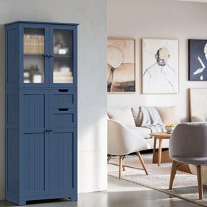 May include: A tall, dark blue storage cabinet featuring two upper glass-paneled doors, two central drawers with cutout handles, and two lower solid panel doors. The cabinet has a vertical plank design on the lower doors and small round knobs.