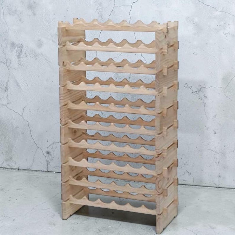 May include: A natural wood wine rack with a capacity for multiple bottles. The rack is constructed from light-colored wood and features a wave-like design to cradle each bottle. The design is a freestanding, vertical structure.